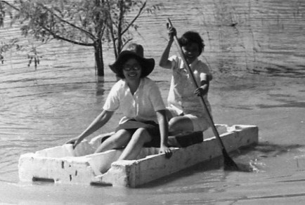 Uwadee and Sakorn paddle over to visit.