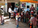 Passing out donated goods at Karin School