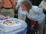 Barbara helps to blow out the candles
