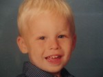 Grandson Biokid #1 - preemie by almost 2 months. Now a linebacker.